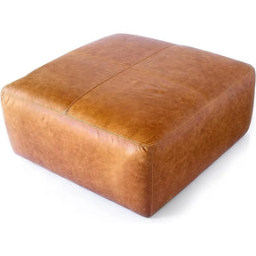 The Morsale Leather Ottoman in Cognac Tan features a large, square design with visible stitched grid patterns, crafted from premium US materials and displayed on a white background.