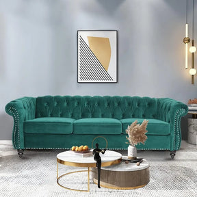 The living room exudes elegance with a Morsale Modern Chesterfield Sofa Couch in teal tufted velvet, surrounded by round coffee tables with decorative items. A framed abstract art piece complements the setting, while modern pendant lights and a textured rug enhance the overall allure.