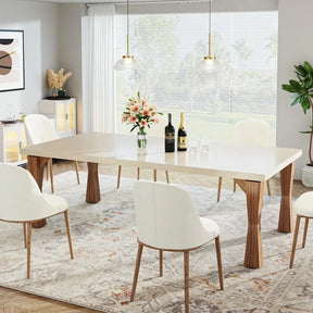 A contemporary dining room features the Morsale Boston 70" Modern Dining Table with a beige top and wooden legs. Six white chairs in a Chinese-inspired design encircle it. Pendant lights hang above, while a large window with blinds beautifully channels natural light.