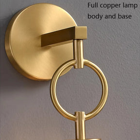 Close-up of the Morsale Copper & Glass Pendant Wall Sconce, showcasing a circular copper base and decorative ring that enhance its sleek design. The wall-mounted lamp, perfect for pendant lighting, is finished with a brushed texture. Text in the upper right corner reads "Full copper lamp body and base.