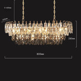 The Morsale Langford Luxury Dining Room Chandelier features gold accents and hand-cut crystals, measures 800mm x 280mm, and can be suspended up to 600mm; crystal pendants beautifully reflect the warm glow inside.