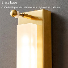 Introducing the Postmodern Luxury Glass & Copper Wall Light by Morsale: This rectangular LED wall lamp highlights a brass base and a frosted white glass shade. Topping it off is an elegant decorative brass element, capturing the essence of modern style lighting. Above, the text reads: "Brass base. Crafted with precision, the texture is high-end and delicate.