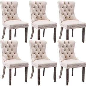 Six Morsale Velvet Tufted Dining Chairs, with tufted backs, studded trim, and dark wooden legs, are arranged in two rows of three. This set combines minimalist modern design with classic elegance.