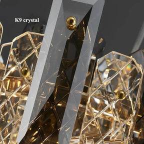 A close-up image showcasing intricate Lazzo Crystal Ceiling Chandelier elements with reflective surfaces that create a geometric pattern. Some parts of the handmade crystals have brass-colored spherical accents. The text "Lazzo Crystal Ceiling Chandelier by Morsale.com" is visible in the upper left corner.