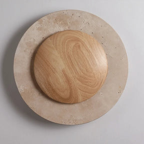 The Natural Travertine LED Decor Wall Light by Morsale.com is a modern LED wall lamp with a circular design, featuring a wooden central circle surrounded by a stone-like ring, both illuminated with a soft, warm glow. Blending Art Deco style and daily lighting needs, this piece creates a serene and ambient atmosphere.