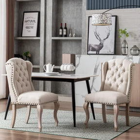 A modern dining area showcases a light wood table paired with Morsale's Farmhouse Dining Room Chairs, featuring beige upholstery and tufted backs. A teapot and cups sit on the table, framed by a deer picture and wine bottles on shelves, while a patterned linen rug enhances floor texture.