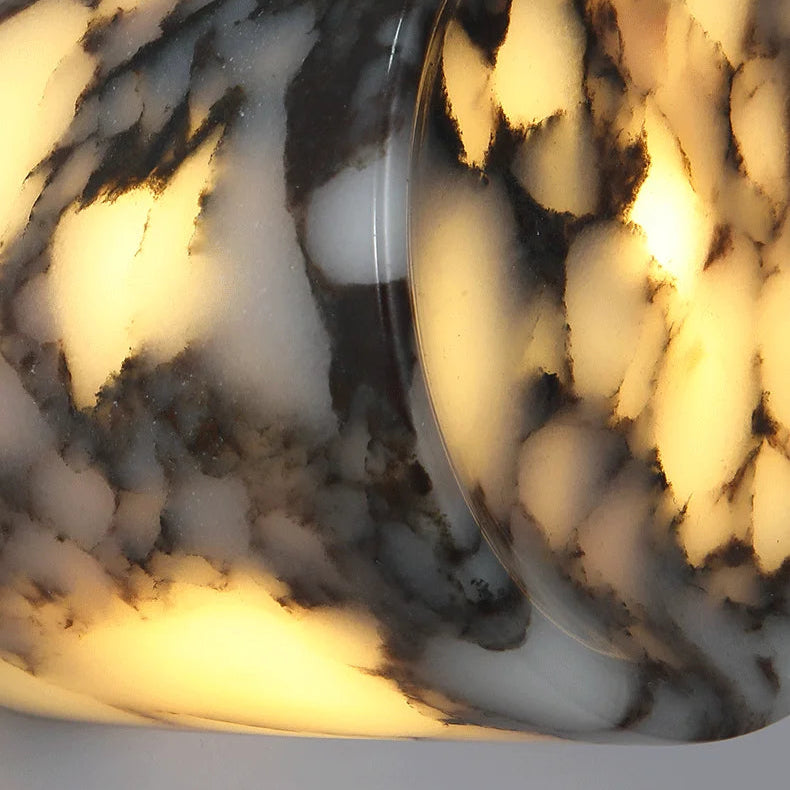 
                  
                    Marble-patterned light fixture with a warm glow
                  
                