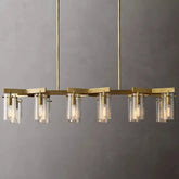 The Leroi Brass Dining Room Chandelier by Morsale is a modern masterpiece featuring a gold-finished design with eight cylindrical glass shades, each housing a light bulb. Suspended from two gold rods, this versatile lighting piece showcases an elegant geometric design against a plain gray background.