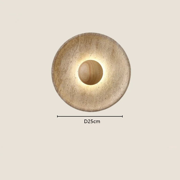 
                  
                    The Oakley Natural Stone & Wood Wall Light by Morsale features a glowing center and measures 25 cm in diameter, bringing elegant LED decor to your space. Mounted on a light beige wall, its natural look adds a unique touch.
                  
                