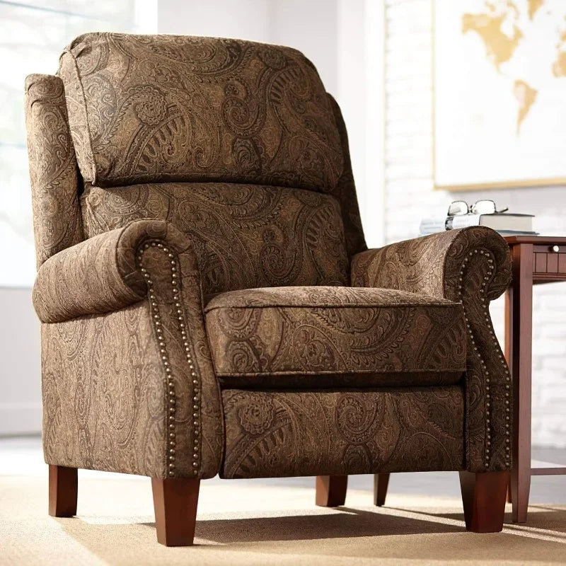 The Morsale Beaumont Paisley Recliner Chair exudes elegance with its brown paisley pattern, wooden legs, and rounded armrests adorned with decorative studs. It complements a nearby wooden side table in a well-lit room, hinting at leisurely moments crafted in Mainland China.