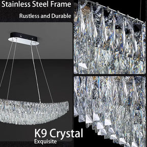 An elegant Gio Crystal Dining Room Light Fixture by Morsale.com with a stainless steel frame and K9 crystal design. Multiple triangular crystal pieces hang in a curved line, reflecting light beautifully. The text reads "Stainless Steel Frame - Rustless and Durable" and "K9 Crystal - Exquisite". Perfect for modern home lighting.