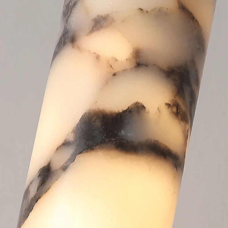 
                  
                    The Valmont Marble Cylinder Pendant Light by Morsale features a creamy white cylindrical design with irregular dark gray and black marbled patterns, resembling polished stone or marble.
                  
                