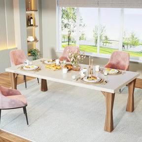 A modern dining room is set for breakfast, featuring the Boston 70" Modern Dining Table by Morsale adorned with pastries and cups. Stylish pink chairs, a window framing a green garden, flowers, candles, a cream rug, and wooden floors complete this elegant space.