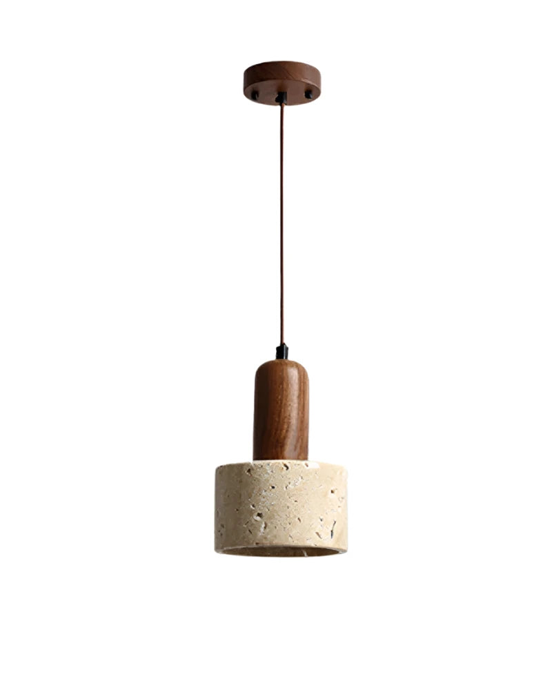 A minimalist kitchen features two Morsale.com Natural Travertine Pendant Lamps with wooden tops and stone-like concrete shades, illuminated by LED bulbs, hanging above a light wood table with a shallow wooden bowl. The background includes a marble backsplash and a counter with minimal décor.