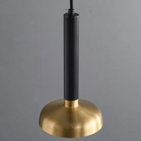 The All Copper Modern Pendant Light by Morsale hangs from the ceiling, boasting a sleek black rod paired with a shiny gold dome-shaped shade. Enhanced with LED bulbs, it casts a warm glow against the gray background.