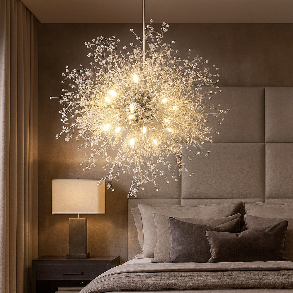 A modern bedroom showcases the Astra 35" Spark Ball Chandelier by Morsale.com, with intricate acrylic beads resembling bursts of crystal, hanging above a neatly made bed and highlighting a bedside table lamp against beige walls.