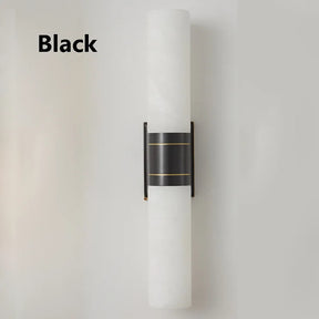Vertical wall sconce with a minimalist design. The light fixture features a cylindrical white lampshade held in place by a black bracket with brass accents. The word "Black" is written in black text on the left side of the image. Introducing the Natural Marble Indoor Wall Sconce Light by Morsale.com.