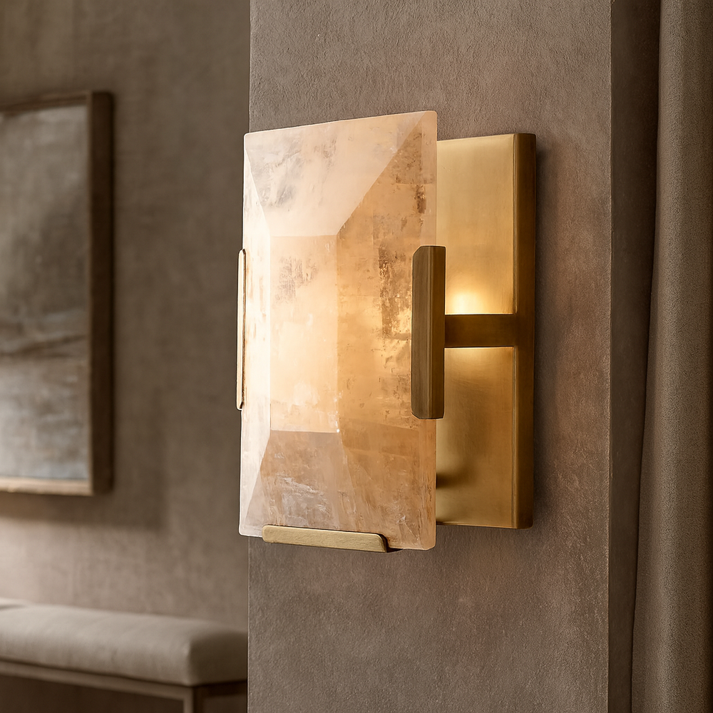 The Brookhill Calcite Crystal Sconce by Morsale.com features a rectangular translucent stone shade and brushed brass hardware, casting a warm glow for elegant indoor hardwired lighting in contemporary spaces.