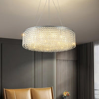 The Alleri Modern Chandelier by Morsale.com hangs from the ceiling in a stylish living room with dark walls, a tan leather sofa, and a vase of flowers on a side table.