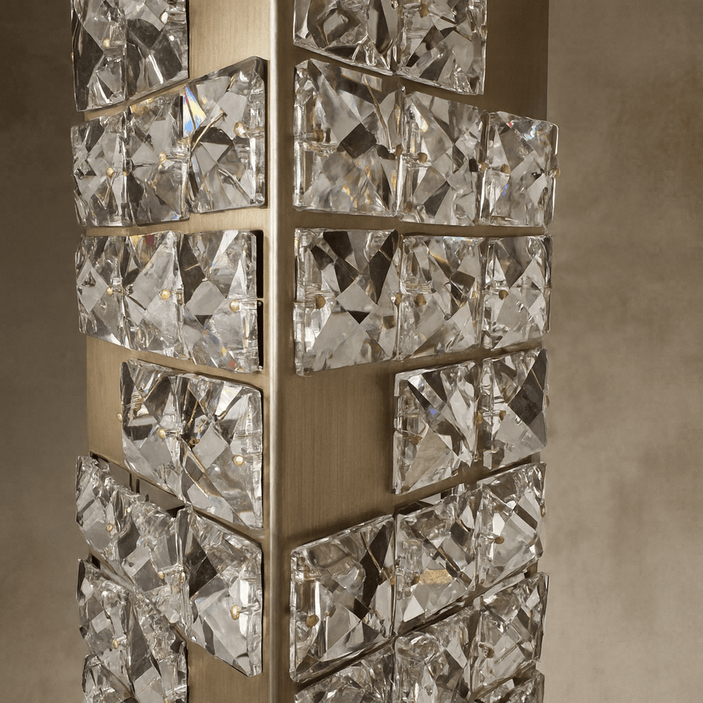 
                  
                    Decorative wall light fixture with crystal-like design on a neutral background
                  
                