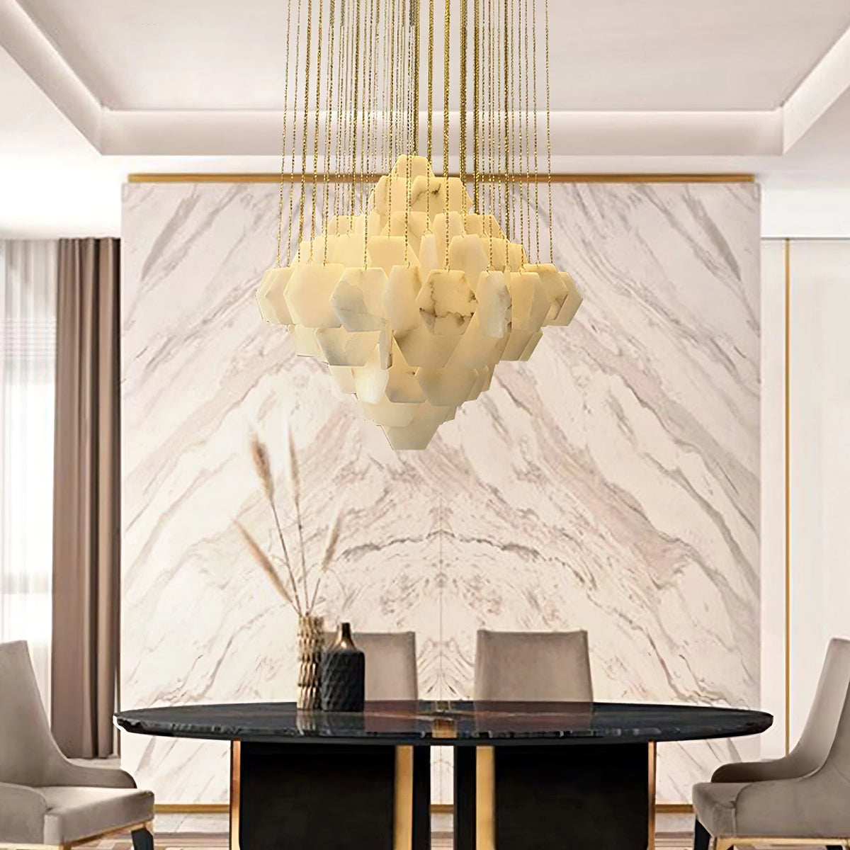 Modern dining room featuring a large, Moonshade Natural Marble Modern Chandelier by Morsale.com in warm hues hanging over a sleek, dark dining table. Surrounding the table are light-brown upholstered chairs. The room has a marble accent wall with subtle light-brown veining and minimalist decor.