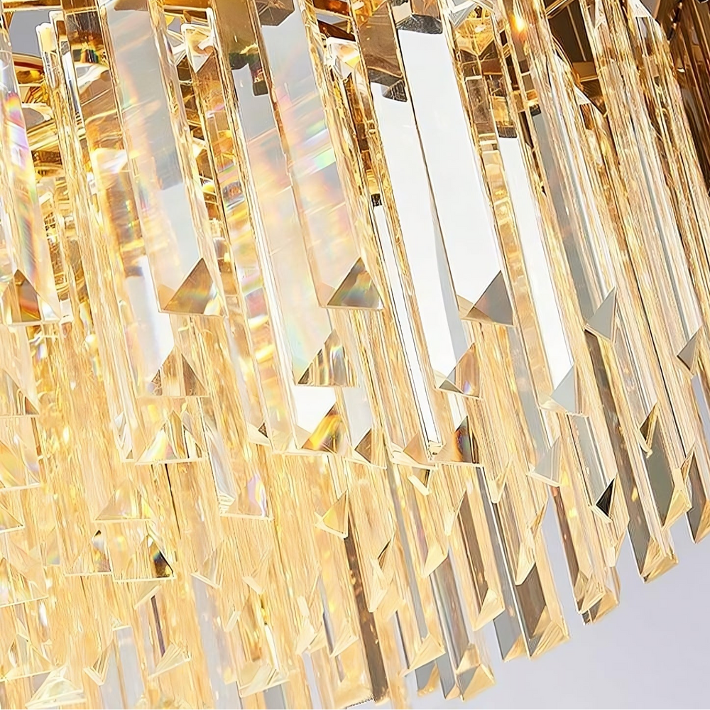 
                  
                    Close-up of the Gio Multi-Layer Crystal Chandelier from Morsale.com, featuring elongated rectangular prisms that reflect warm golden light. This shimmering design highlights the chandelier’s elegance and makes it a stunning luxury centerpiece.
                  
                