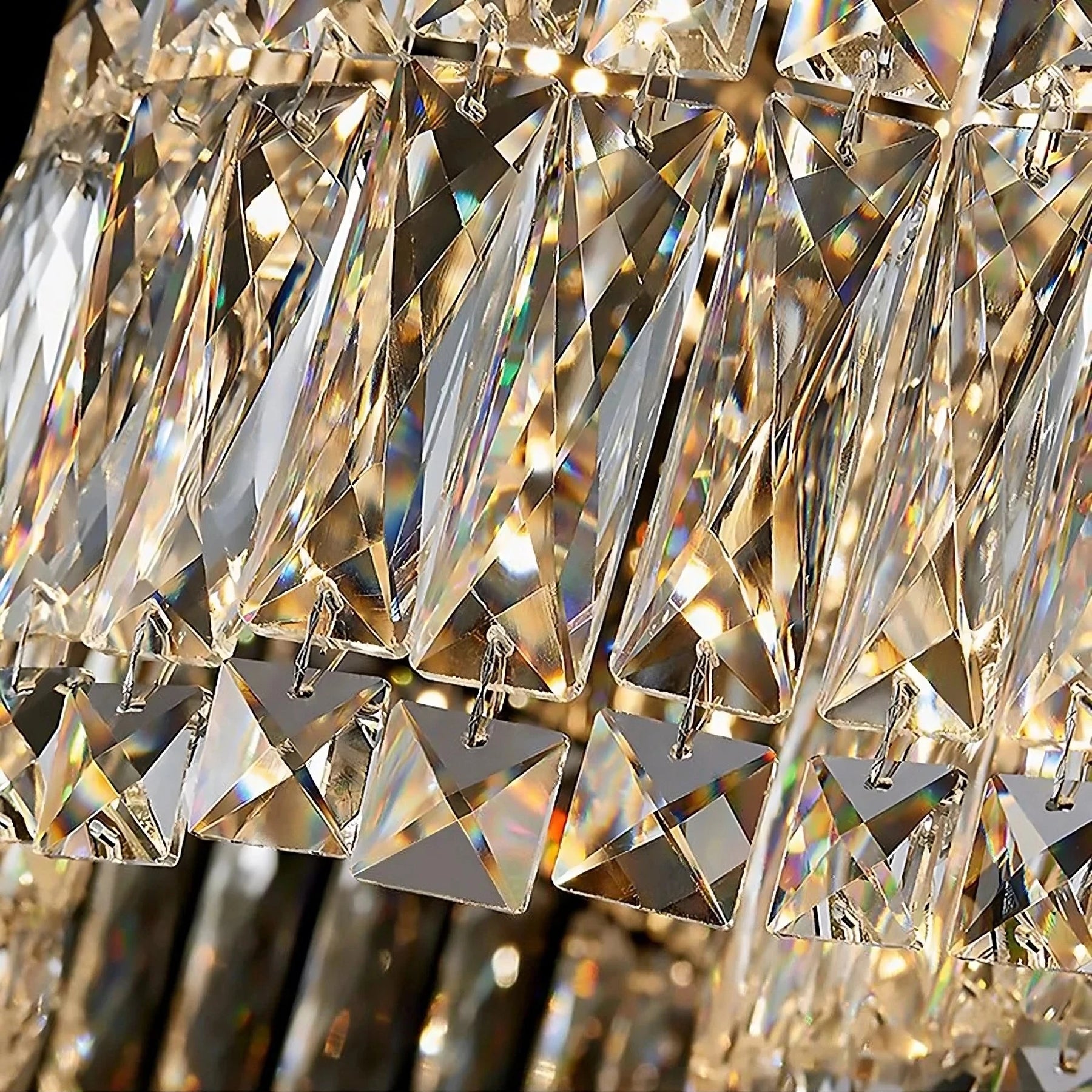 Close-up of the Bacci Crystal Chandelier for dining room from Morsale.com, showcasing its high-quality clear crystal prisms. The crystals are intricately cut, reflecting light and creating a dazzling, complex pattern. The text below reads, "High quality clear crystal.