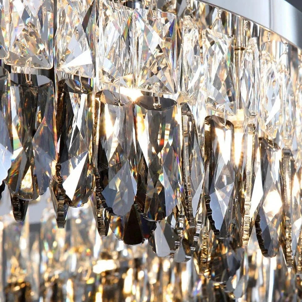 Close-up of a Giano Crystal Ceiling Light by Morsale.com, showing numerous dangling crystal pendants reflecting and refracting light. The intricate arrangement creates a sparkling and elegant visual effect. The light shines through the crystals, casting a radiant glow.