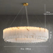 The Marble & Crystal Modern Chandelier by Morsale.com is a large, round luxury home decor piece with a 100 cm diameter and 20 cm height. It hangs elegantly from the ceiling using adjustable wires up to 150 cm. This sophisticated chandelier features a white shade adorned with crystal-like details along the bottom edge, exuding both elegance and modernity.