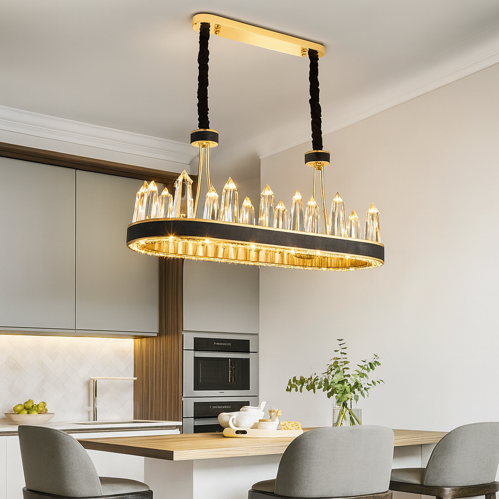 A modern kitchen with light wood cabinets, built-in ovens, and the Gainford Dining Chandelier by Morsale.com hanging over a wooden island with chairs, a teapot set, and a vase filled with green branches.