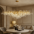 The 62" Albero Dining Room Crystal Chandelier by Morsale.com adds luxury above a round dining table for two in an elegant, neutral-toned living room—an exquisite choice for sophisticated dining room lighting.