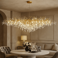 The 62" Albero Dining Room Crystal Chandelier by Morsale.com adds luxury above a round dining table for two in an elegant, neutral-toned living room—an exquisite choice for sophisticated dining room lighting.