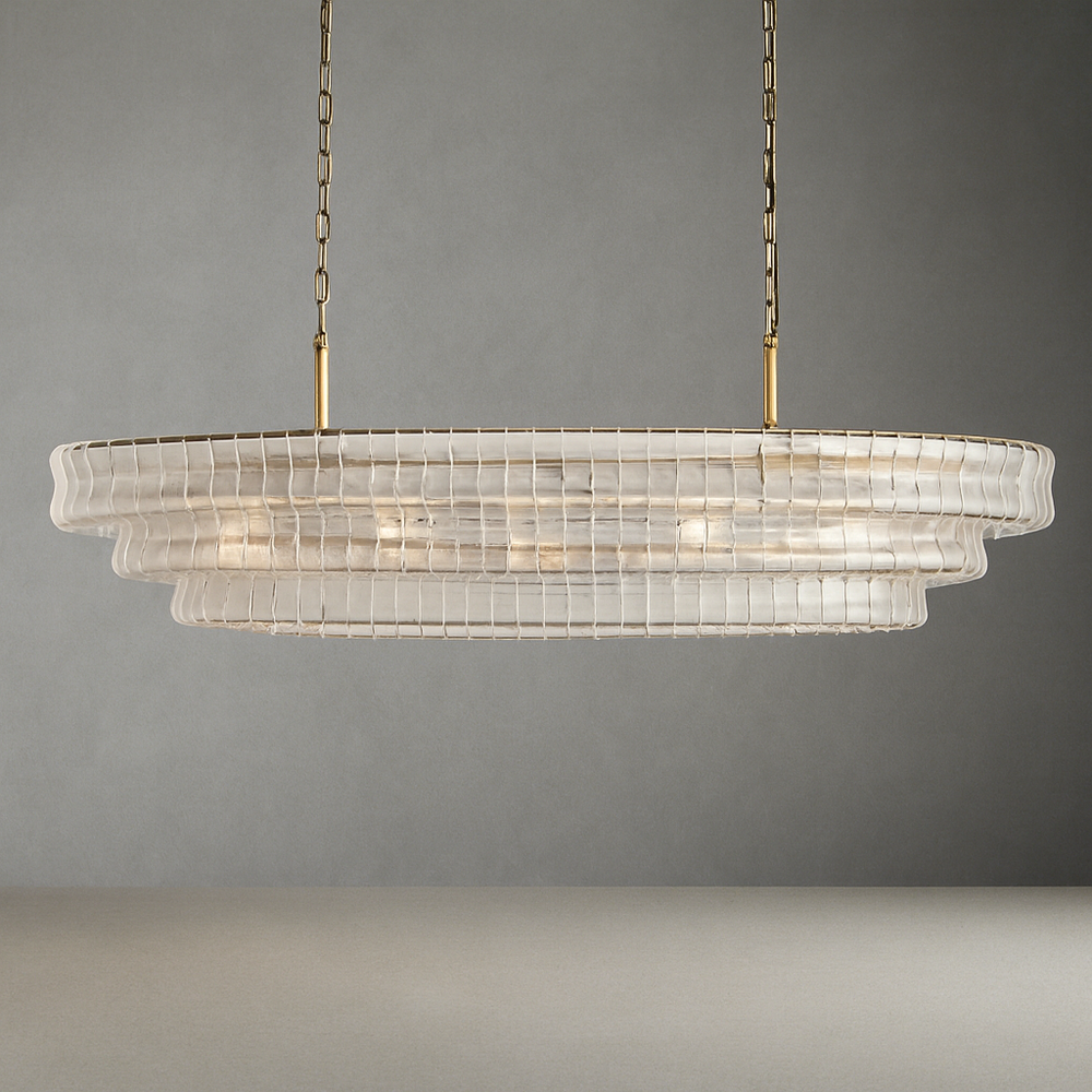 The Riviera Vintage Crystal Dining Room Chandelier by Morsale features a modern design with layered clear panels, suspended from two brass chains. Its warm and glowing light exudes sophistication and contemporary elegance, making it the perfect addition to enhance any dining room setting.
