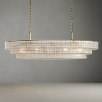 The Riviera Vintage Crystal Dining Room Chandelier by Morsale features a modern design with layered clear panels, suspended from two brass chains. Its warm and glowing light exudes sophistication and contemporary elegance, making it the perfect addition to enhance any dining room setting.
