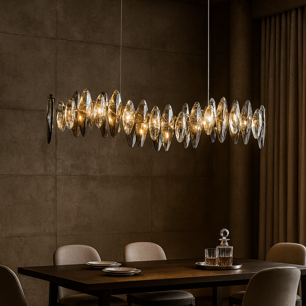 Dining room with a modern chandelier, wooden table, and chairs.