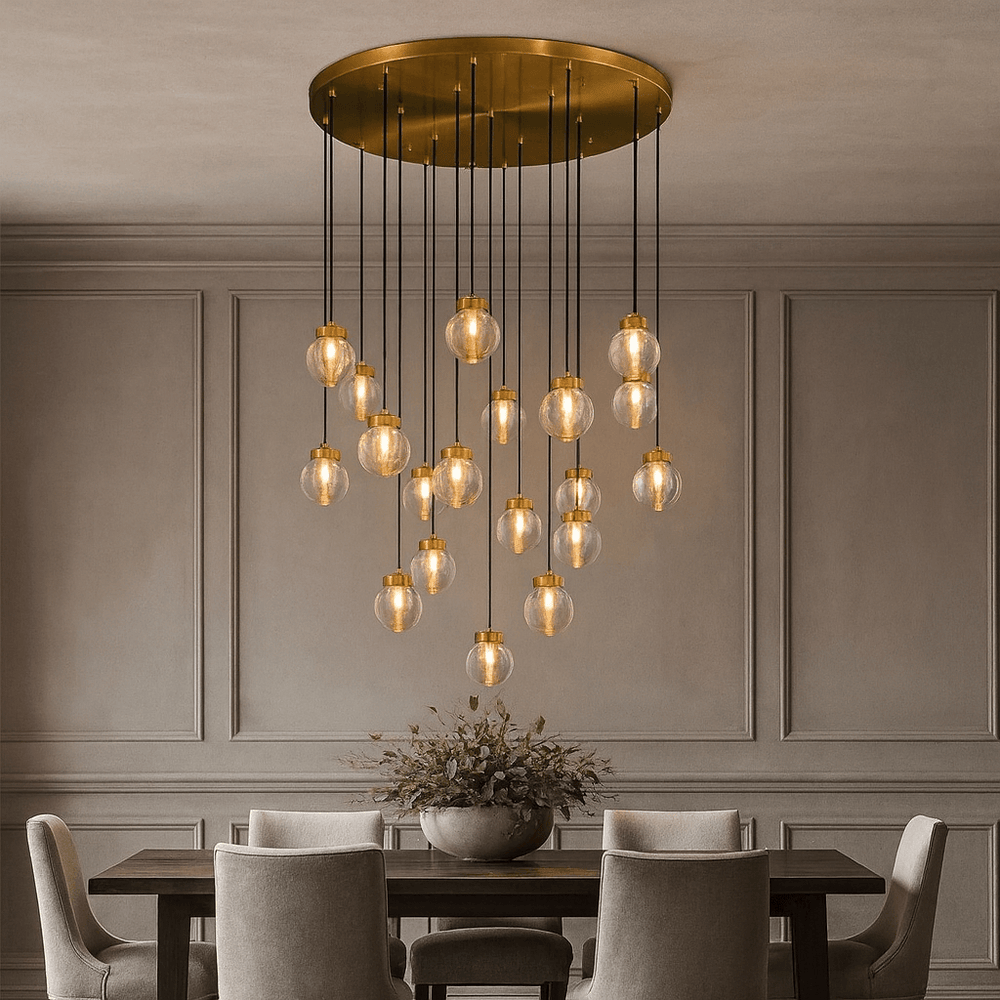 A modern dining room featuring a dark wooden table, four upholstered chairs, a bowl of greenery, and the Morsale Bossen 19-Globe Modern Chandelier as a statement piece against light gray paneled walls.