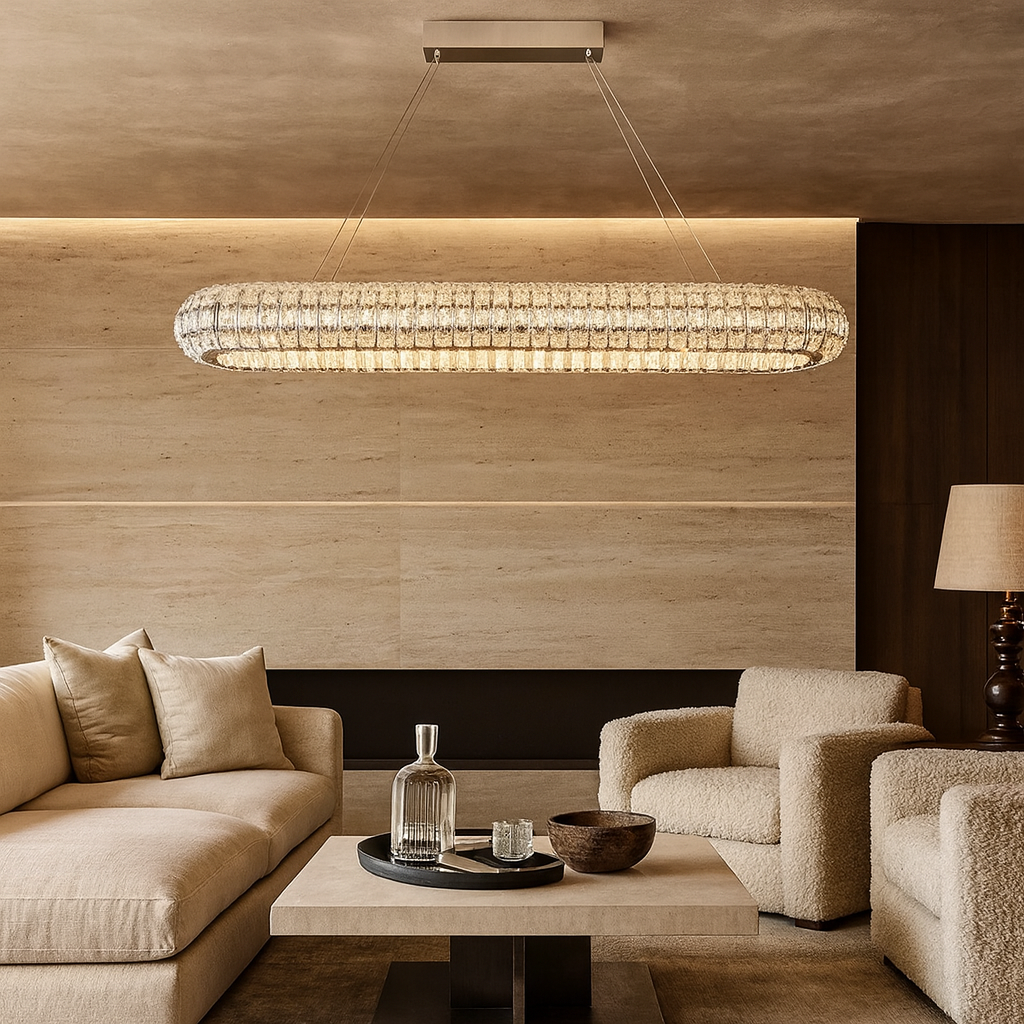 A modern living room with beige and cream furniture, a square coffee table with glassware, and the Morsale Bacci Crystal Modern Chandelier hanging overhead. The walls feature light stone panels.