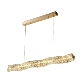 The Bacci Modern Crystal Dining Room Light Fixture by Morsale.com features a sophisticated rectangular pendant design with a gold ceiling mount and two thin wires suspending a crystalline, textured, elongated LED fixture. The light emits a warm glow, enhancing the elegant ambiance against a neutral gray backdrop—an ideal choice for contemporary dining spaces.