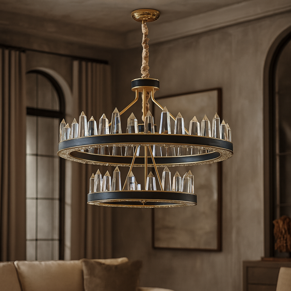 The Villa 2-Tier Contemporary Chandelier by Morsale.com, with gold and black accents and vertical crystal prisms, is displayed in a stylish living room with neutral walls, arched windows, and a plush beige sofa.