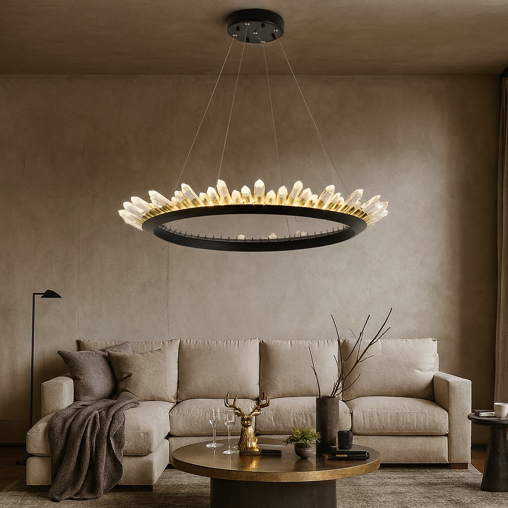 A modern living room features a beige sofa, round coffee table, and the Collins Crystal Farmhouse Chandelier by Morsale.com. Minimalist decor and neutral tones create a cozy, sophisticated ambiance highlighted by the elegant crystal lighting.
