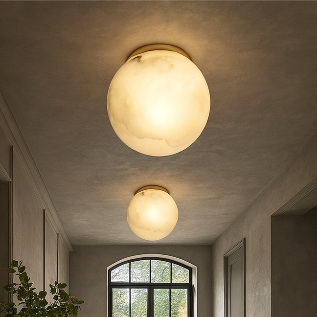 
                  
                    Hallway with ceiling lights, a plant, and a large window.
                  
                