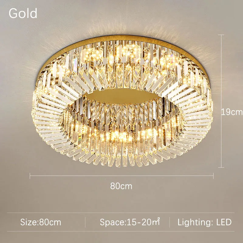 The Specchio Crystal Ceiling Light by Morsale.com is a gold-toned, round LED flush mount featuring crystal prisms elegantly arrayed along its perimeter. Measuring 60 cm in diameter and 19 cm in height, it is ideal for spaces of 10-15 square meters. The design is completed with resilient stainless steel accents on the frame.