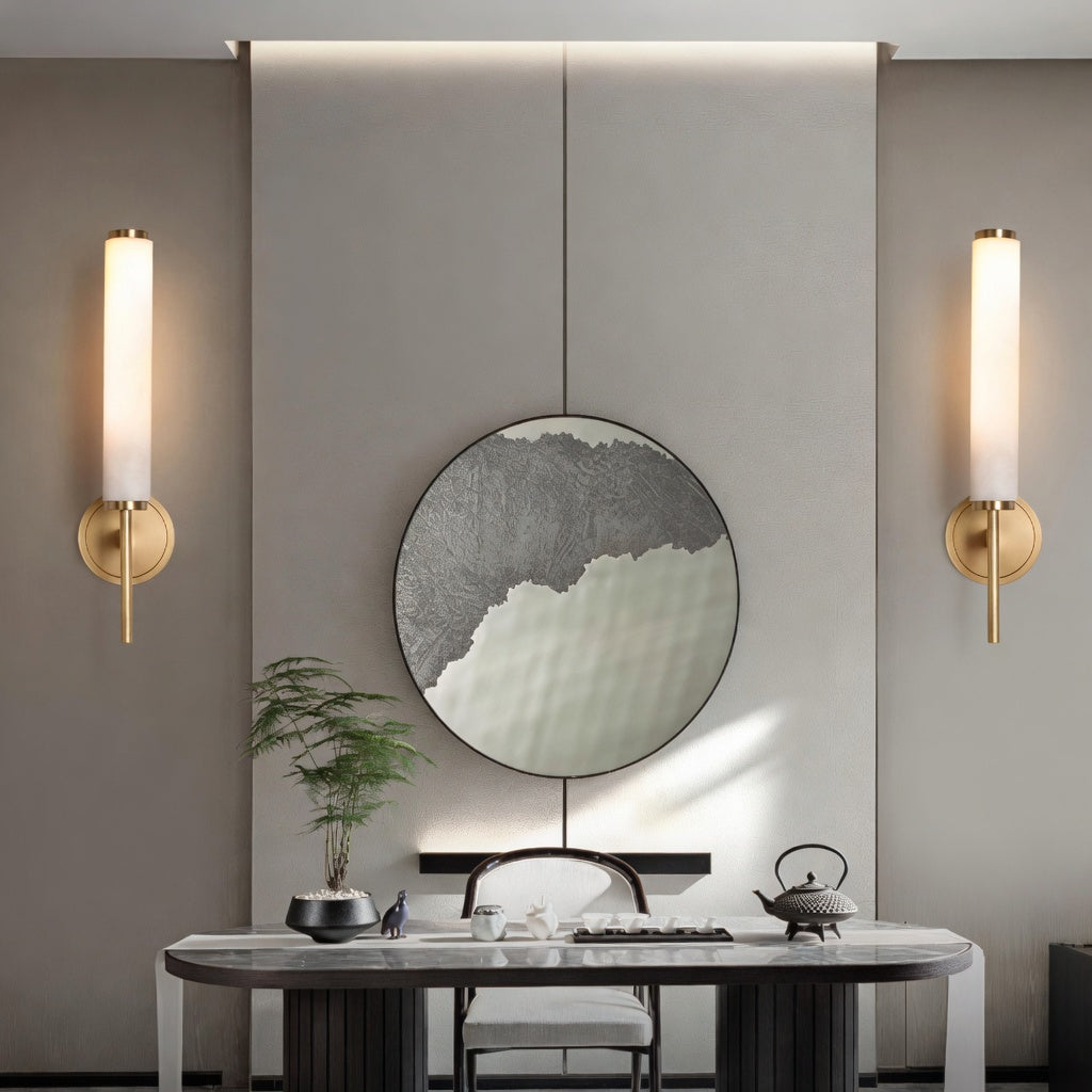 Modern interior design with a round mirror, table, and wall lights.
