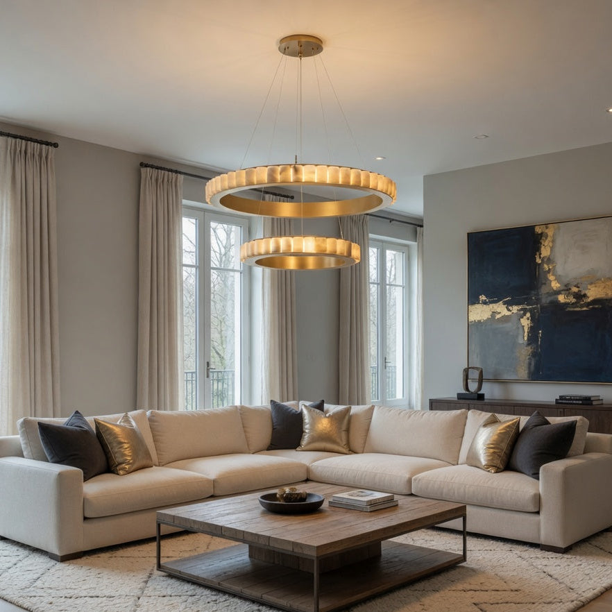 Modern living room with a beige sectional sofa, wooden coffee table, and decorative pillows.
