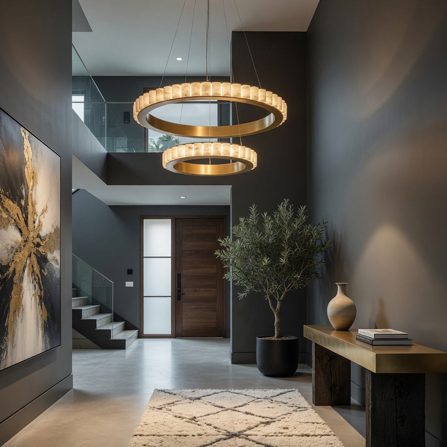 Modern interior hallway with a chandelier, artwork, and decorative elements.