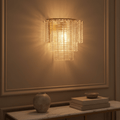 Palermo glass and crystal wall sconce above a console
