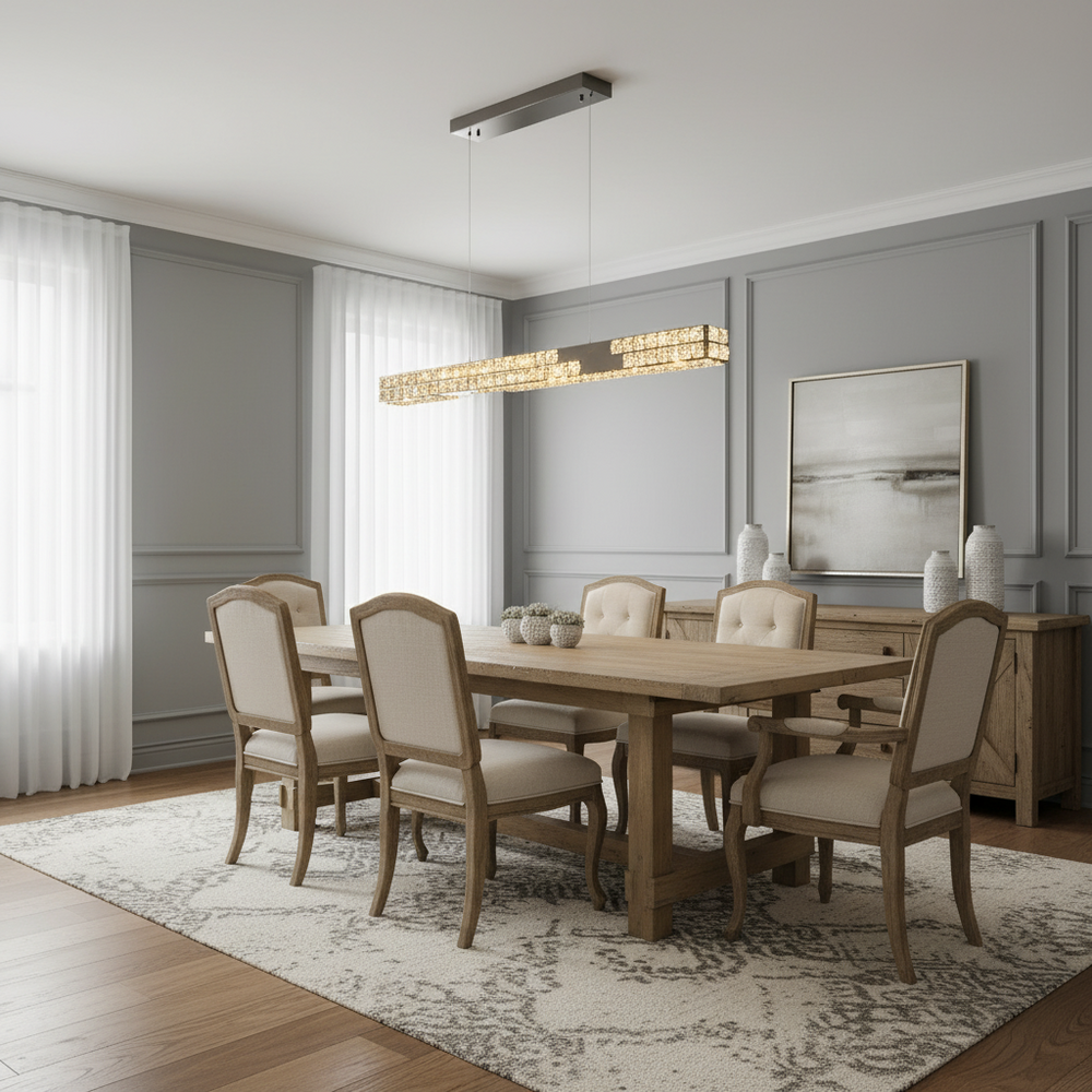 
                  
                    A modern dining room with a wooden table, six upholstered chairs, a patterned rug, a sideboard with vases, an abstract painting, and two Langley Crystal Dining Room Chandeliers from Morsale.com. Light streams through sheer curtains.
                  
                