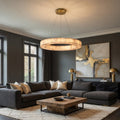 Modern living room with dark gray sectional sofa, wooden coffee table, and abstract art on wall.