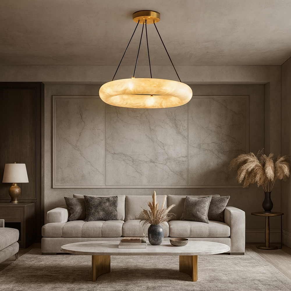 
                  
                    A modern living room features a beige sofa, gray and brown pillows, a marble coffee table, pampas grass in vases, and the Morsale Trenton Marble Chandelier as a stunning ceiling centerpiece. Neutral decor is accented with gold and wood touches.
                  
                