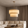 A modern living room features the Morsale Valmont Marble Chandelier 39" above a wooden coffee table. A beige sectional sofa and neutral decor complete the warm, minimalist look.